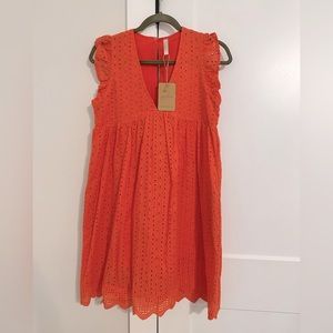 Tangerine, eyelet dress with shorts underneath